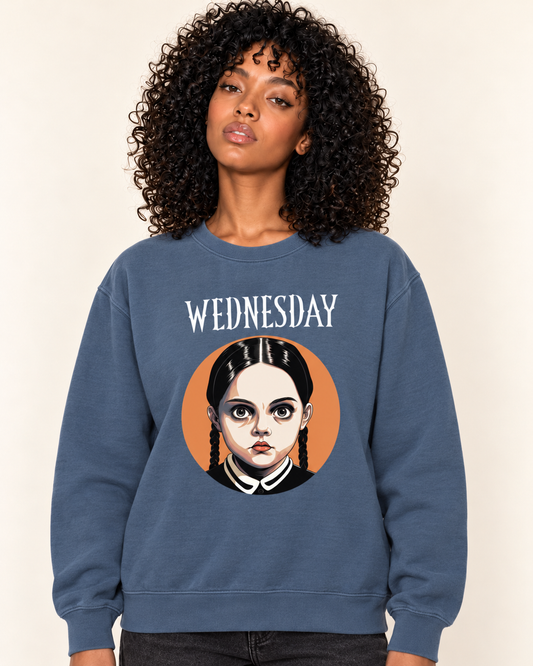 Wednesday - Heavyweight Sweatshirt — Blue Jean on Treattees studio model, matching actual CustomCat print placement