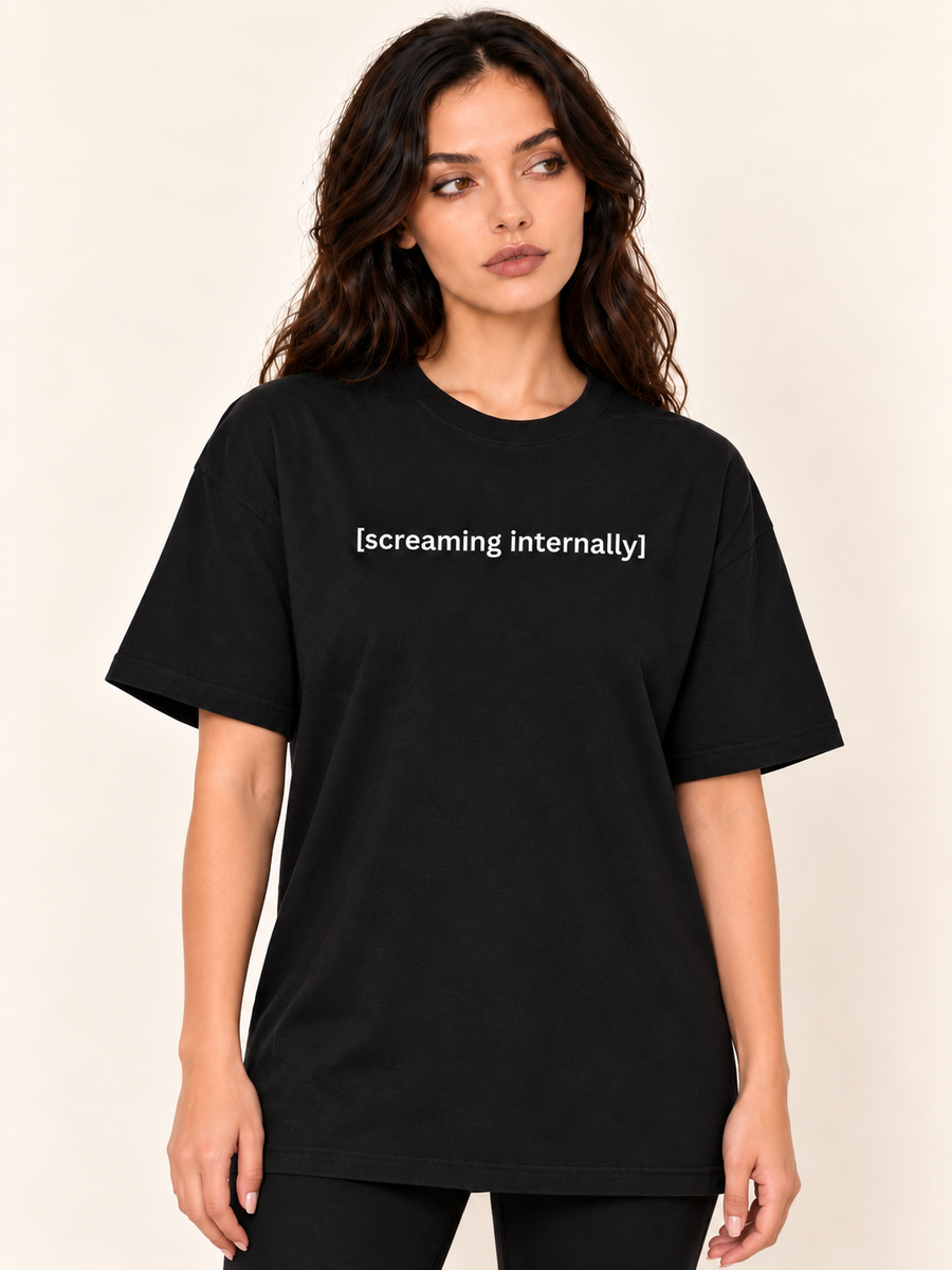 Screaming Internally black oversized tee - brunette model with naturally relaxed arms