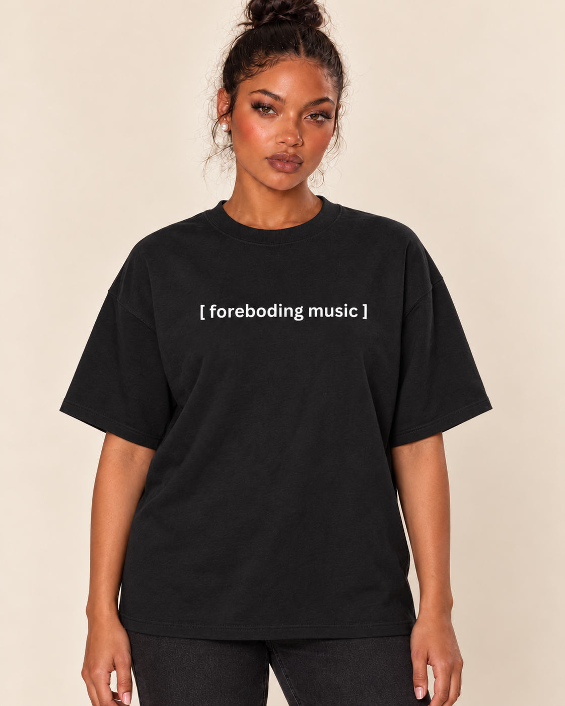 [Closed Captions] Foreboding Music - Unisex Oversized Boxy Tee — Black on Treattees studio model, matching actual CustomCat print placement