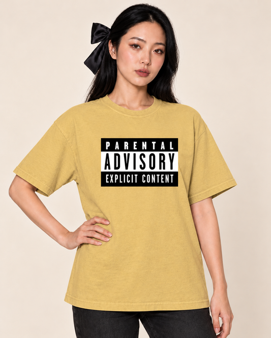 Parental Advisory - Oversized Tee — Mustard on Treattees studio model, matching actual CustomCat print placement