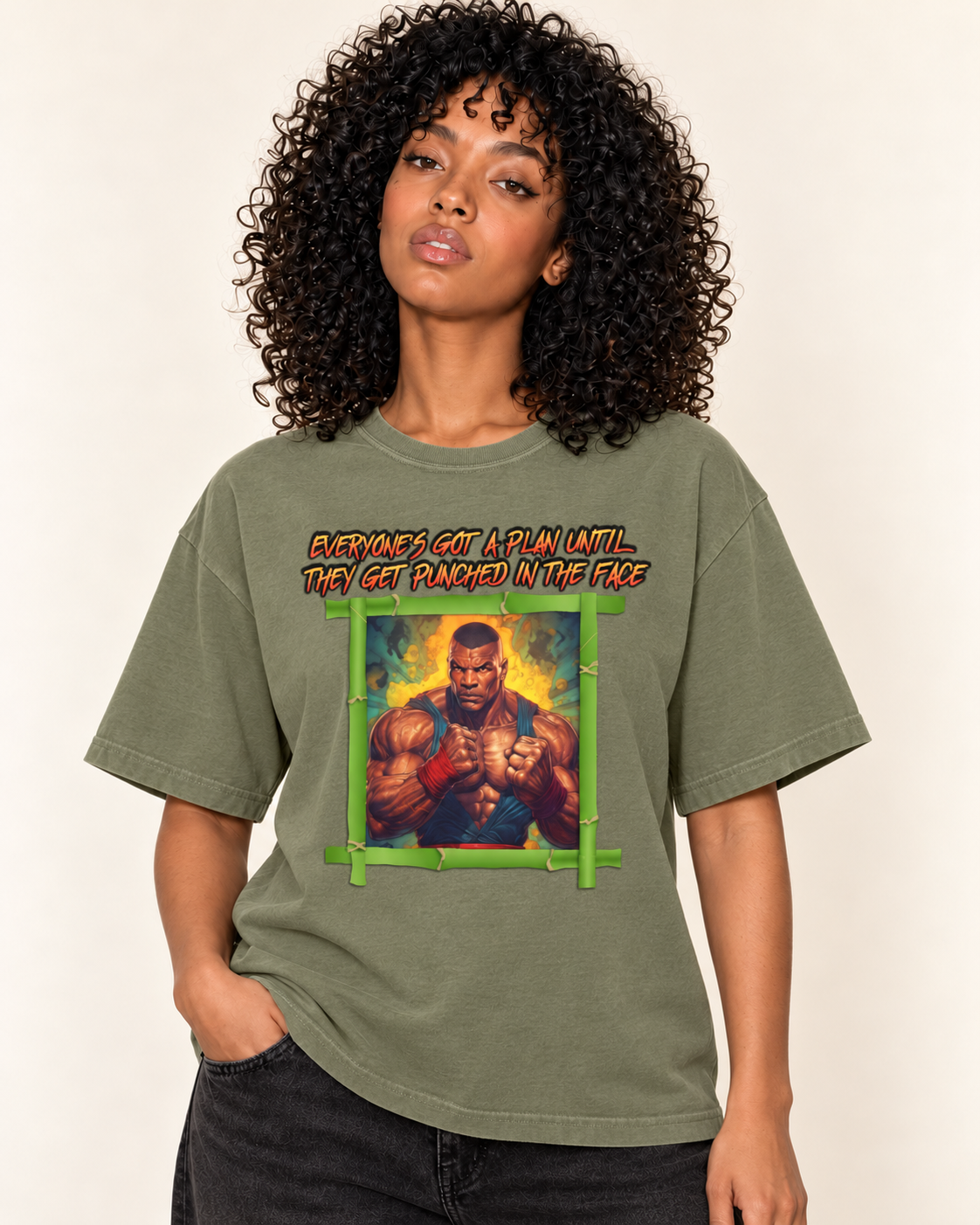 Everyone's Got A Plan Until They Get Punched In The Face - Oversized Tee — Moss on Treattees studio model, matching actual CustomCat print placement