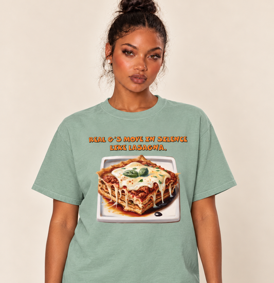 Real G's Move In Silence Like Lasagna – Relaxed Heavyweight Tee — Bay, existing Treattees model, direct crop, original print unchanged