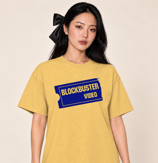 Blockbuster Video – Relaxed Heavyweight Tee — Mustard, existing Treattees model, direct crop, original print unchanged